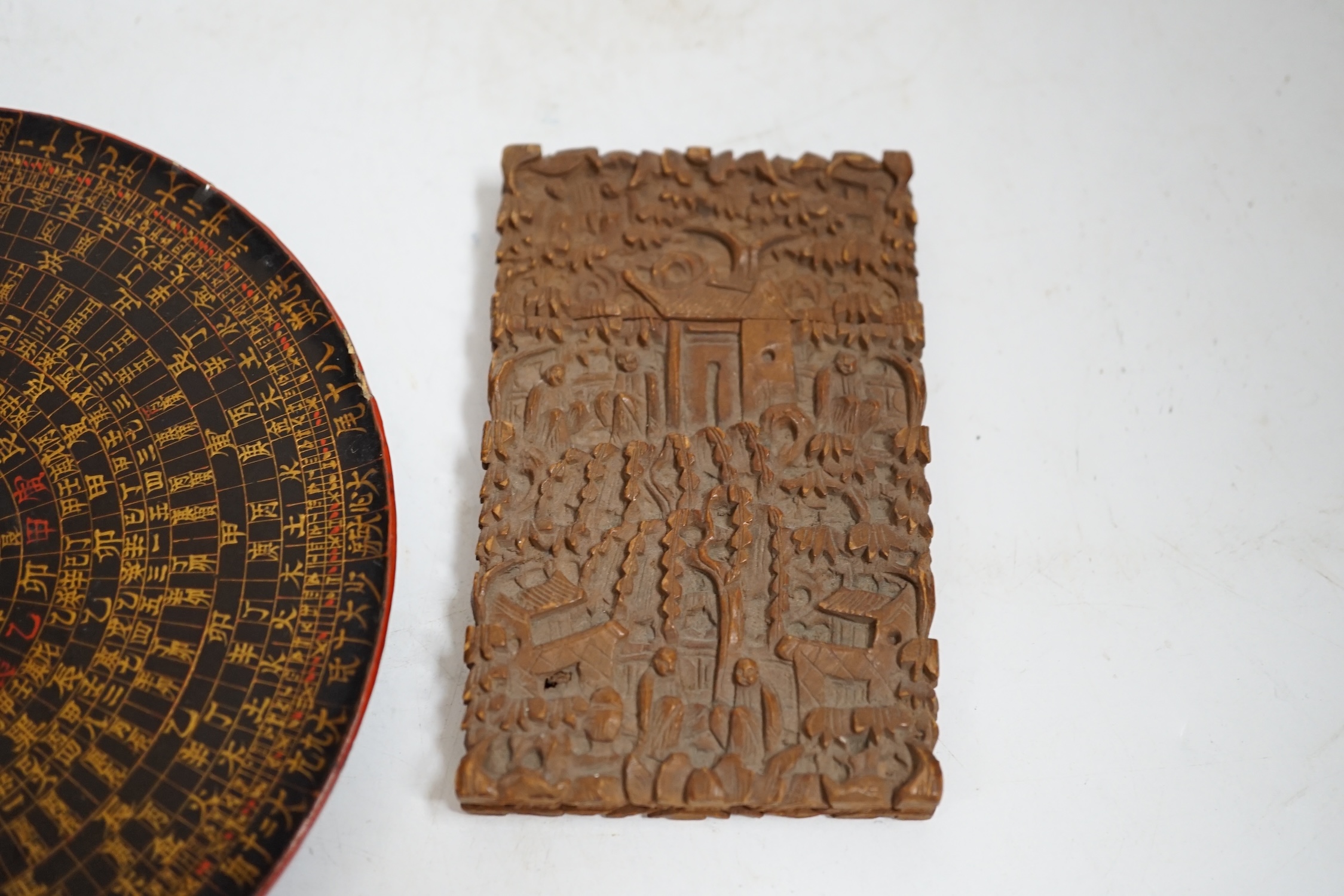 A Chinese sandalwood card case, carved with figures and Chinese Feng Shui lacquered compass, largest 14cm in diameter. Condition - fair, compass lacking